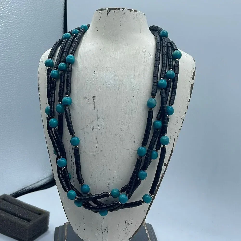 Vintage 4 strand wooden beaded boho festival necklace.